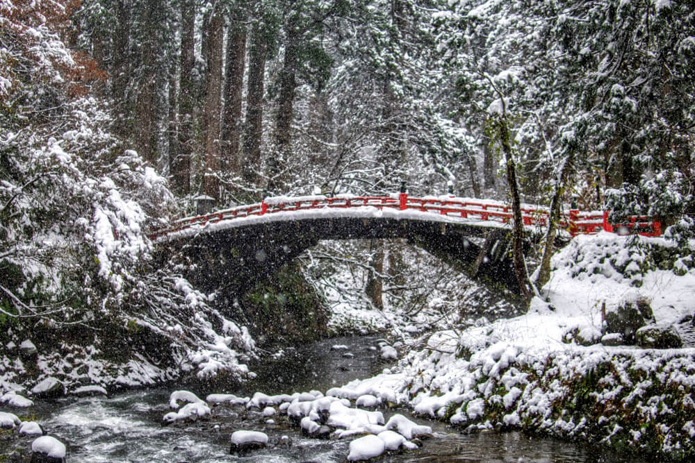 Shinkyo Bridge over the Haraigawa River at the base of Mt. Haguro of the Dewa Sanzan in the deep snow