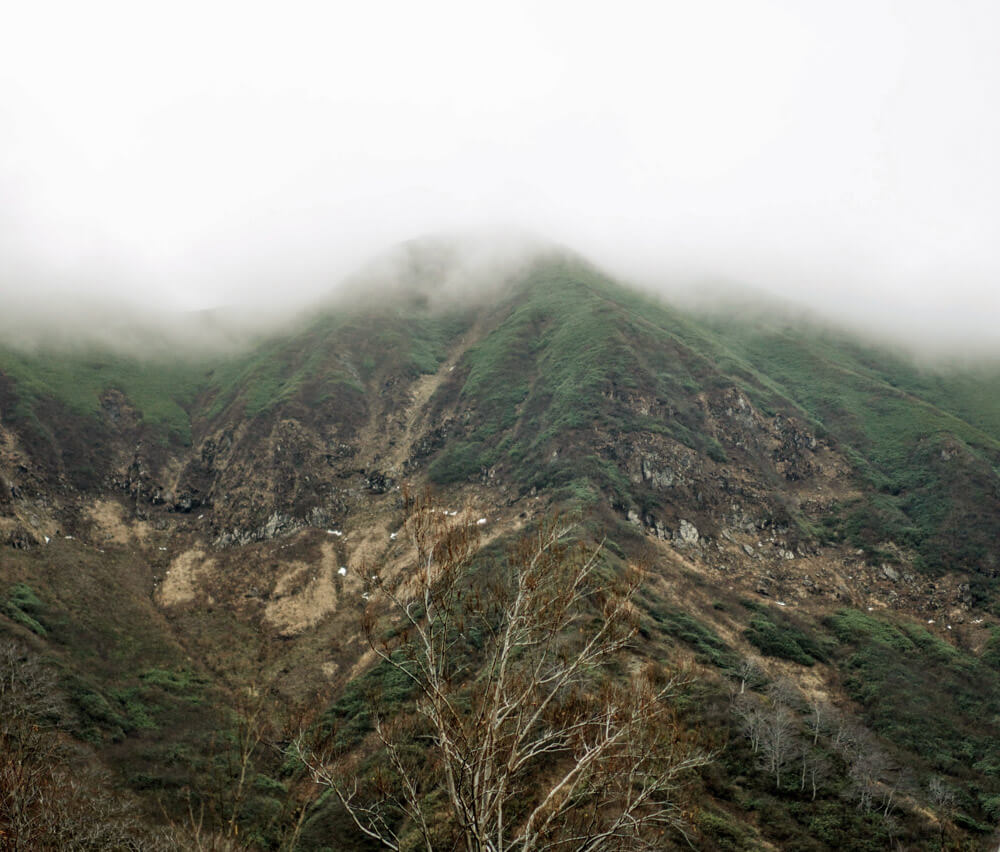 Mt. Yudono shrouded in fog. Expect scenes like this on a Dewa Sanzan hike.