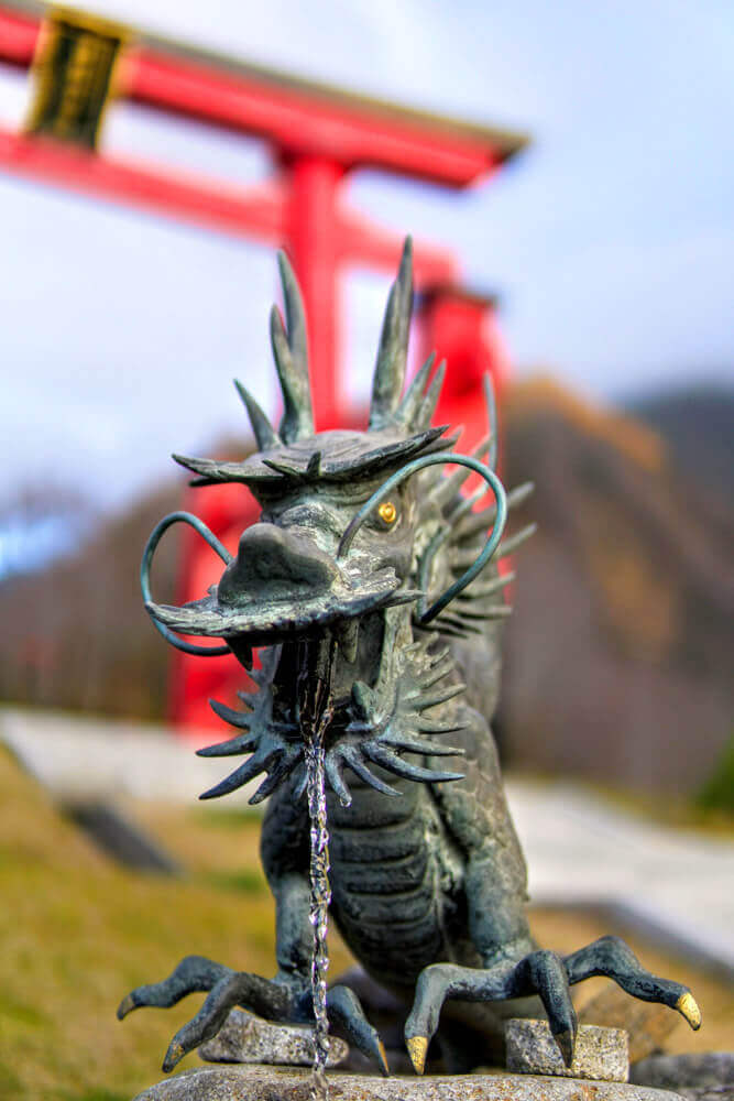 A dragon in front of The Shrine Gates of Mt. Yudono of the Dewa Sanzan in Autumn