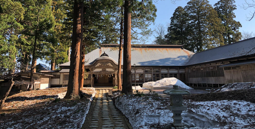 The buildings of Saikan during the melting snow of spring