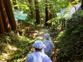 Yamabushi train on the stone stairway amongst the cedars on Mt. Haguro of the Dewa Sanzan