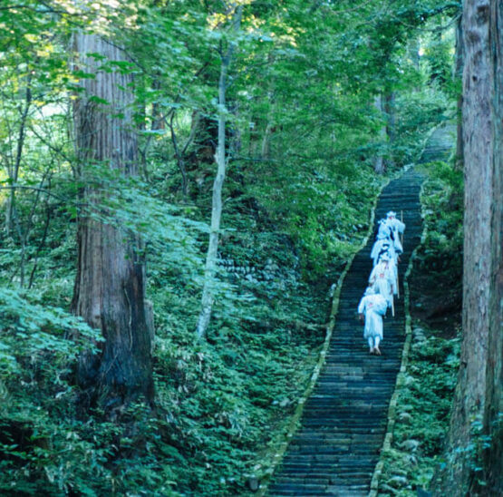 Yamabushi train on the stone stairway of Mt. Haguro of the Dewa Sanzan